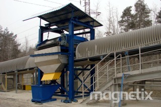 High-power electromagnetic separator - removal of tramp iron from rock output.