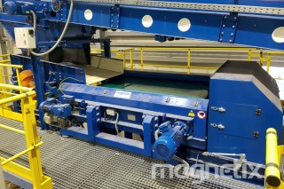 Eddy current separator - installation under the conveyor with the oversize fraction of municipal waste.