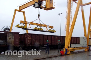 A set of electromagnetic grippers - unloading of bundles of steel bars.